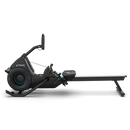 A black rowing machine with a digital display, footrests, and a long sliding seat, shown from the side against a plain white background.